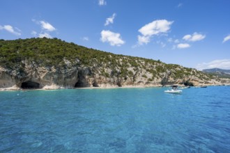 Clear blue water and picturesque rocky coast, Cala Luna cliffs and beach, Golfo di Orosei, Baunei,