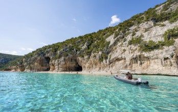 Turquoise clear water and picturesque rocky coast, Cala Luna cliffs and beach, Golfo di Orosei,