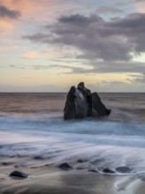 Sunset, waves and rocks in the sea, Praia Formosa, Madeira, Portugal