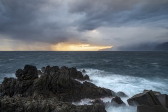 Sunrise, waves and rocks, coast near Porto Moniz, Madeira, Portugal