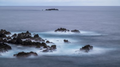Sunset, long exposure, waves and rocks, coast near Porto Moniz, Madeira, Portugal