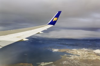 Wing, airplane, Icelandair airline logo, flying to Boston, view of Reykjavik, aerial view, Iceland