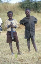 Portraits of two boys, one of them holding a large knife, Bwangu Mzimba, Malawi, Africa, June 2000,