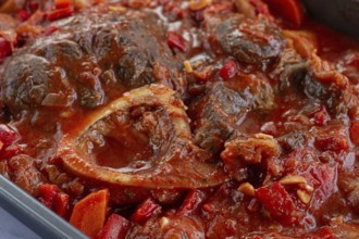 Ossobuco stew with vegetables, knuckle on the bone with new potatoes, in tomato sauce, homemade,