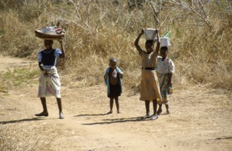 Girl with payloads, little boy, Malawi, Africa, June 2000, vintage, retro, old, historic