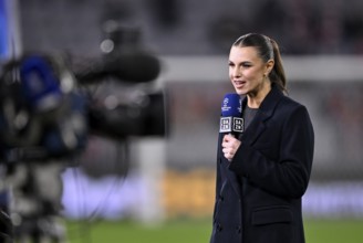 DAZN presenter Laura Wontorra with microphone, logo, Champions League, Allianz Arena, Munich,