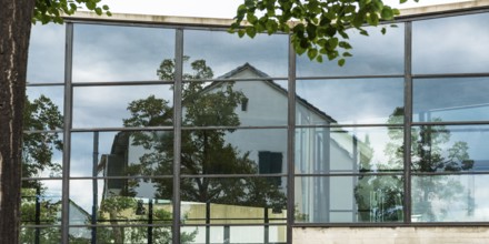 House is reflected in glass faÃ§ade, architecture, reflection