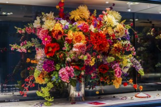 Huge colorful bouquet of flowers in shop window, decoration