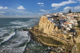 Scenic view of the seaside Azenhas do Mar fishing village on cliff on Atlantic ocean coast,