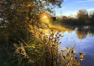 Atmospheric sunrise over the Lippe river in autumn, Lippeaue, Lippstadt, North Rhine-Westphalia,