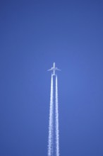 Airplane with contrails, Germany