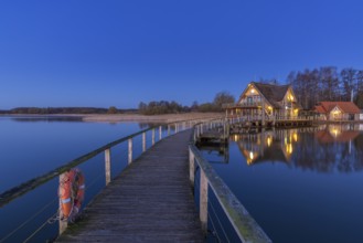 Lakehouse Â°54, bistro and bar on Lake Hemmelsdorf / Hemmelsdorfer See at sunrise in spring near
