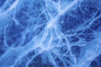 Close-up of blue ice, made of compressed snow, structure showing cracks and fissures inside