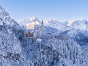 Wonderful winter scenery with Neuschwanstein Castle in the midst of a majestic mountain landscape