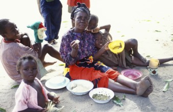 Local family eating, Kande, Malawi, Africa, July 2000, vintage, retro, old, historic