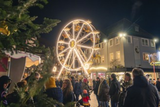 Lively Christmas market with brightly lit Ferris wheel, Christmas market 2025, Nagold, Black