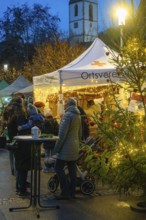 A Christmas market with a tent and lights at night, Aidlingen Christmas market, Böblingen district,
