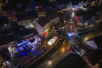Aerial view of a village at night with lights and Christmas tree, Aidlingen Christmas market,