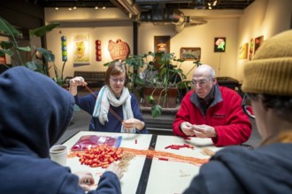Detroit, Michigan - Volunteers with the Detroit Peoples Assembly put together whistle kits. The