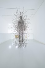 Abstract sculpture made of steel wire in a minimalistic white room, Open Horizons exhibition,
