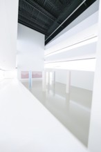 White room with various structural elements and minimal decor, Open Horizons exhibition, Schauwerk