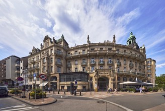 Historic building, former hotel palace hotel, barrier bollard, street, round faÃ§ade with windows,