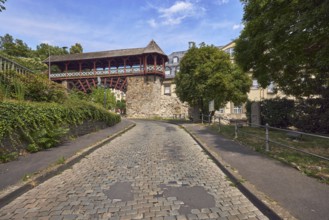 Heidenmauer, historicizing city gate Römertor, city fortification, lantern, metal fence, trees,