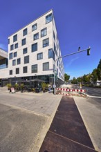 Commercial building, modern architecture, outdoor area of a restaurant, waffle house, fenced