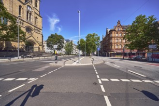 Street, general architecture, houses, church, traffic light intersection, central island, trees,