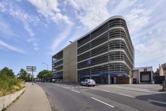 CoulinstraÃŸe car park, modern architecture, pavement made of concrete paving stones, wall made of