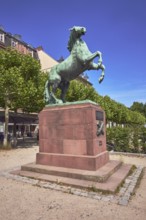 Orange monument, horse sculpture, trees, general architecture, blue sky, cirrus clouds,