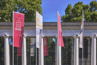 Spa hotel colonnades, colonnades, flags on flagpoles, spa hotel Wiesbaden, historic building,