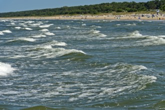 Play of Baltic Sea waves on the beach of the seaside resort of Ahlbeck, Usedom island,