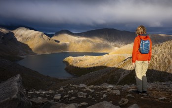 Hiker at Upper Tama Lake, Tama Lake Walk (Tama Lakes Track), evening light, golden hour, Tongariro