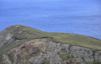 Eire sign from World War II, Portacloy loop cliff walk, Muingnabo, County Mayo, Ireland