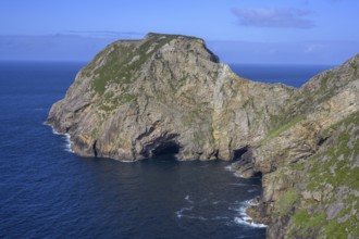 View of blue sea and cliffs with rock gate from Portacloy Loop Cliff Walk, Muingnabo, County Mayo,