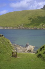 Rusted winch above small harbour, Portacloy loop cliff walk, Muingnabo, County Mayo, Ireland