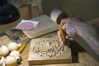 Craftsmanship in a workshop where wood is carved and hand tools are visible, Old Town, Sharambeyan