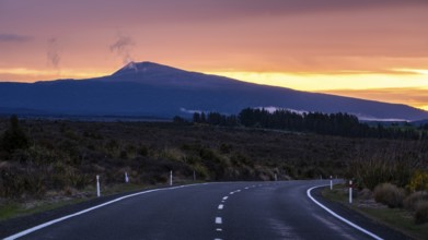 Roadshot, landscape and road SH 47 at sunset, Mount Hauhungatahi in the background. Tongariro