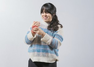 Asian woman with arthritis and hand pain isolated. Unhappy asian girl suffering with pain hands