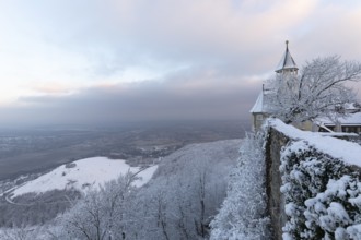 A wonderful winter landscape shows the snow-covered Teck Castle as the first rays of sunshine