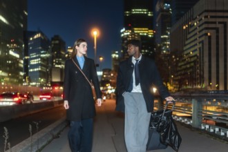 Business colleagues traveling together, walking on a city bridge with their luggage at night,