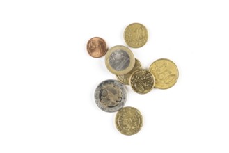 Different euro coins of different denominations on a white background