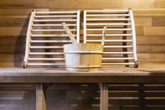 Steam and hot stone wooden cedar compact sauna interior with heating stone electrical device, hot