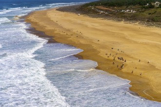 View of the extensive beach from the platform at Farol de Nazare, Portugal
