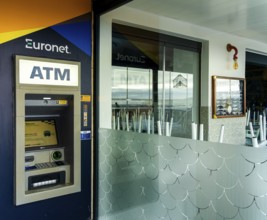 ATM cash machine next to a restaurant, Nazare, Portugal