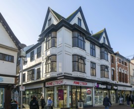 Shops in historic buildings corner of Dial Lane and Tavern Street, town centre of Ipswich, Suffolk,