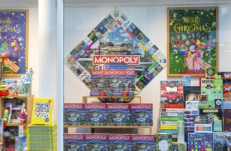 Monopoly and other board games in window display of Waterstones bookshop, Ipswich, Suffolk,