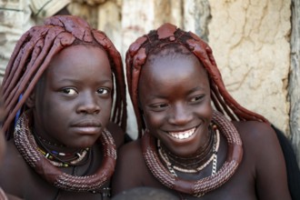 Himba woman laughing, traditional Himba village, Kaokoveld, Kunene, Namibia