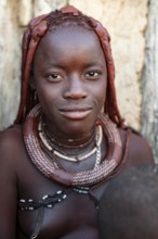 Himba woman smiling, traditional Himba village, Kaokoveld, Kunene, Namibia
